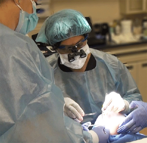Dr Amiya Prasad performing eye surgery
